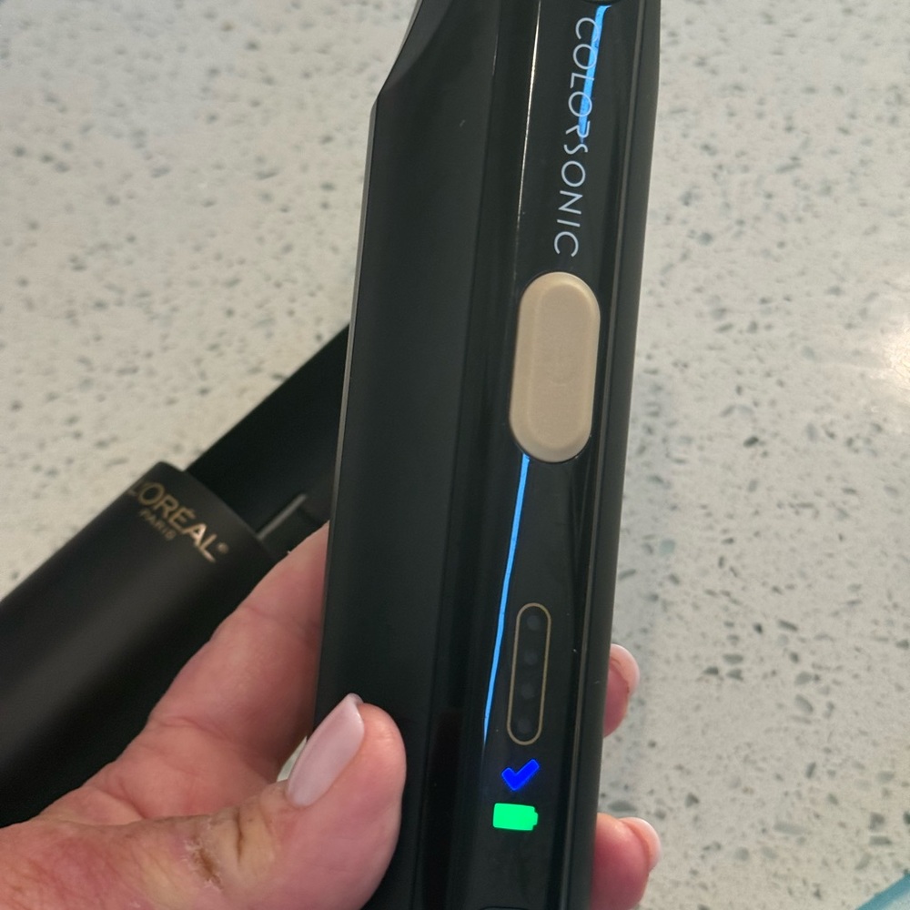 L'Oreal Colorsonic Device in Black with Gold and Blue Accents